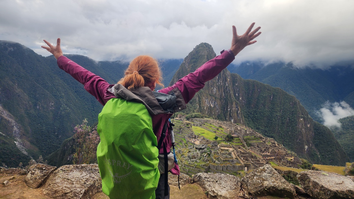 A woman at Machu Picchu on a women-only guided Inca Trail tour with Explorer Chick