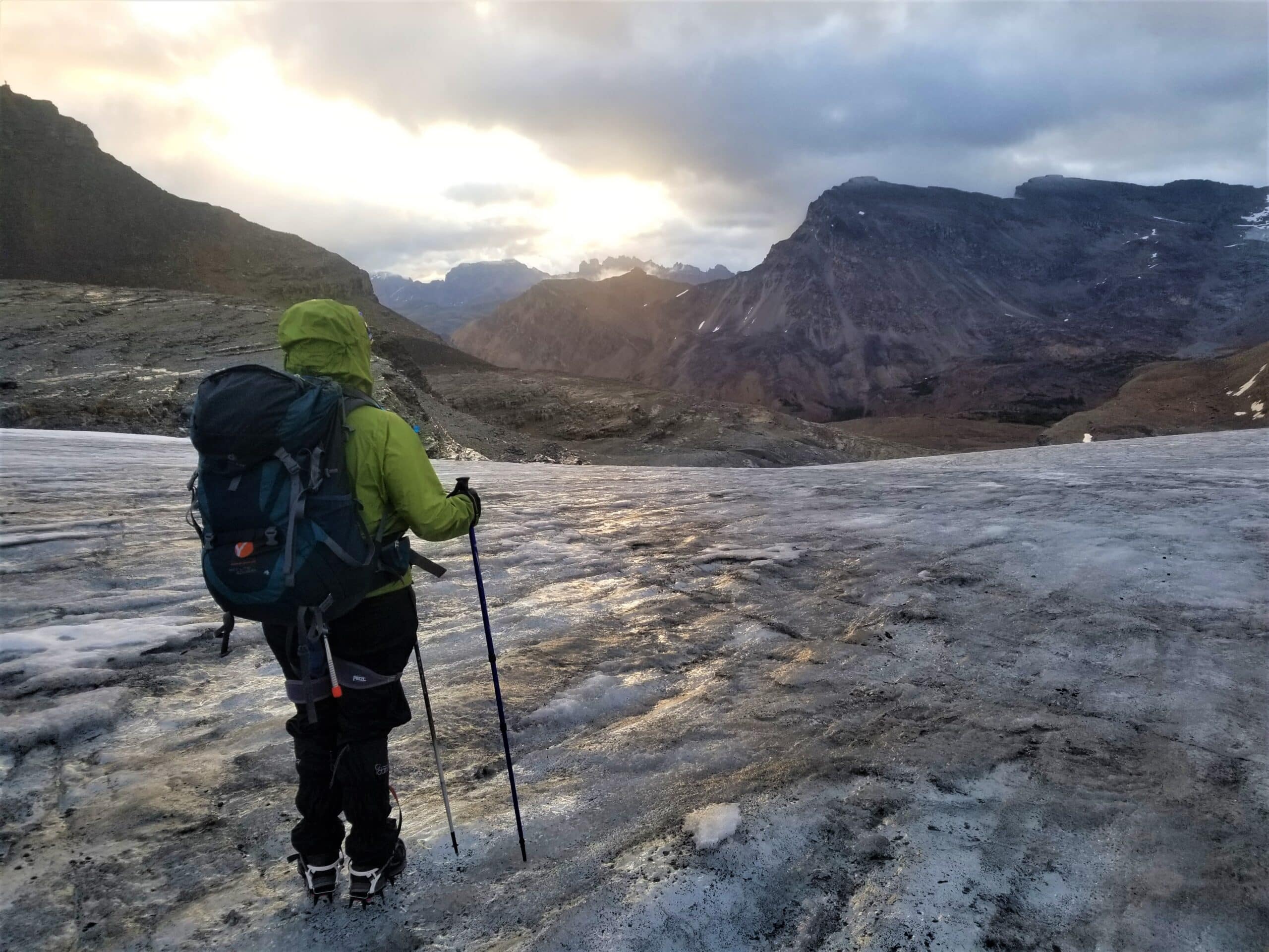 An Explorer Chick woman wearing a backpacking pack while hiking