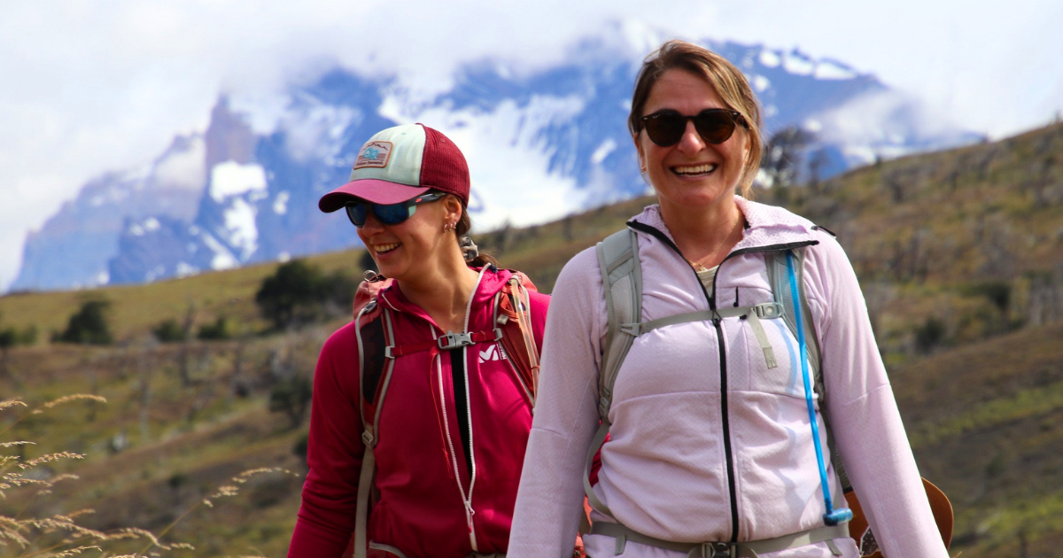 Two women hiking together in Torres del Paine National Park in Chilean Patagonia