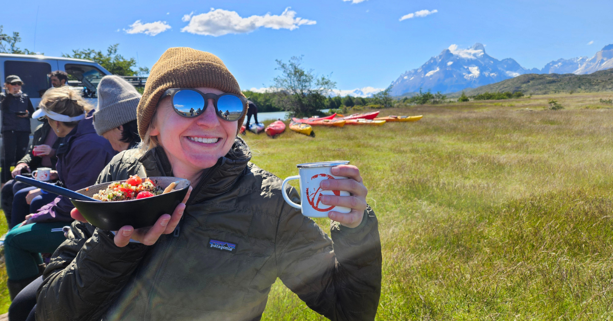 Woman enjoying lunch during a multisport adventure in Torres del Paine, Patagonia