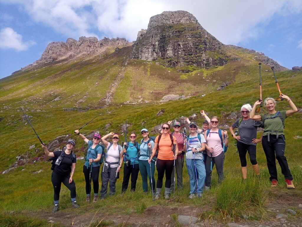 Women walking along a mountain trail in Scotland