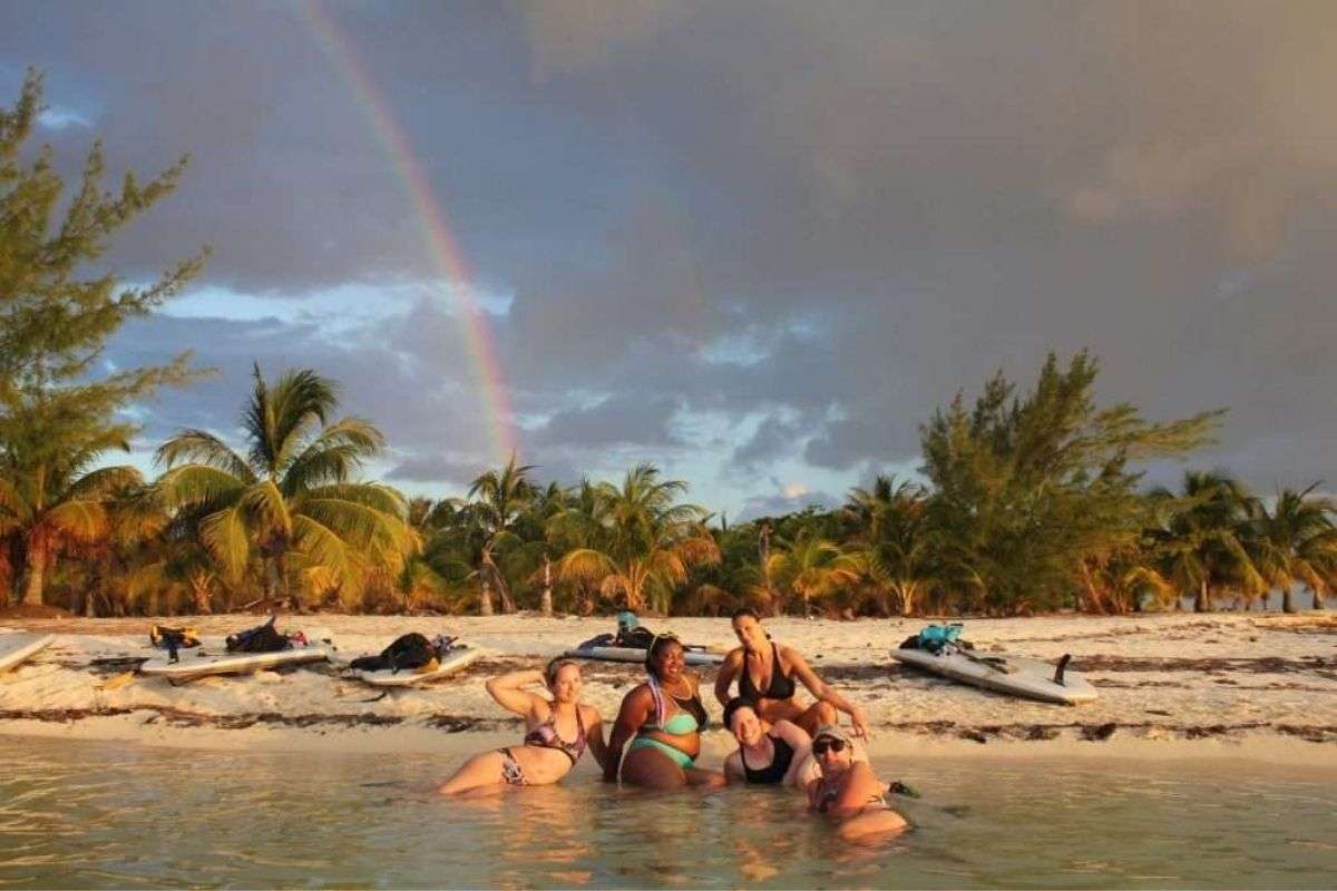 women pose as mermaids in Belize