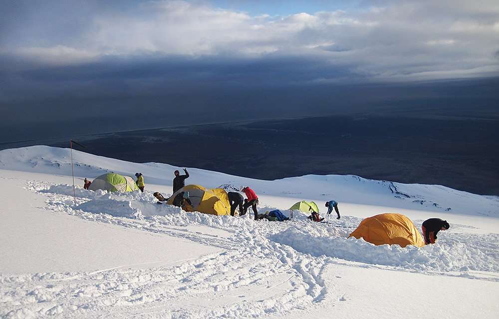 women camping in cold weather on a mountain