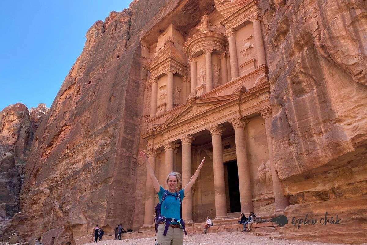 woman standing in front of Al Khazneh, "The Treasury" in Lost City of Petra, Jordan