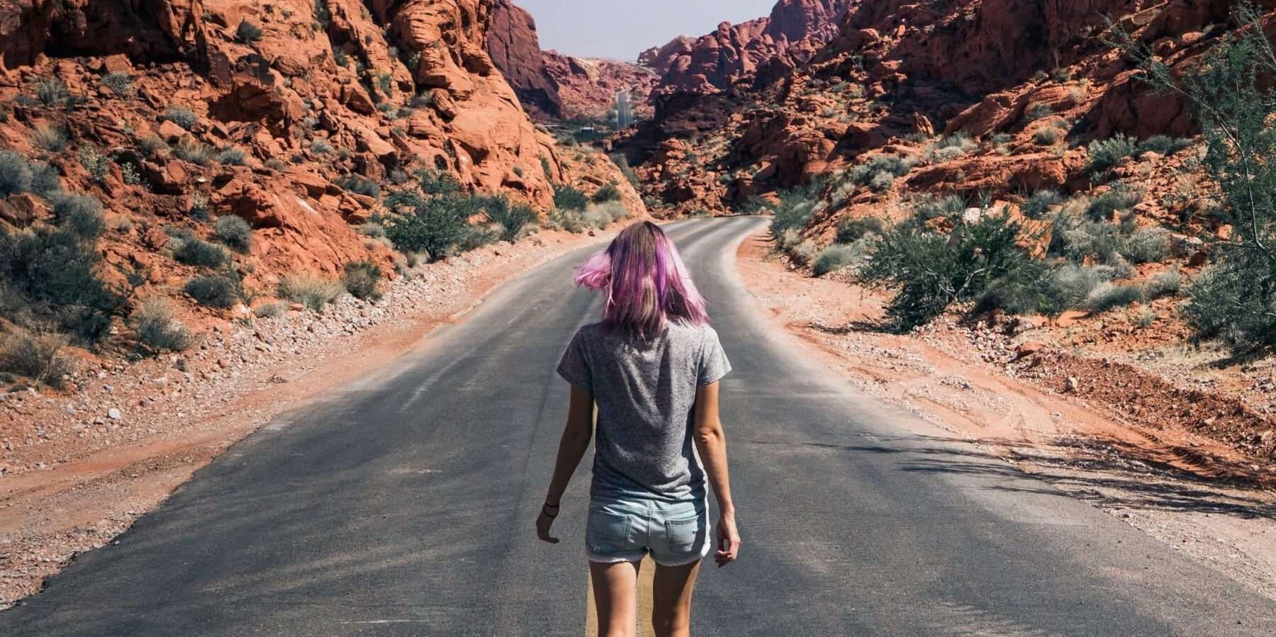 woman walking on deserted road