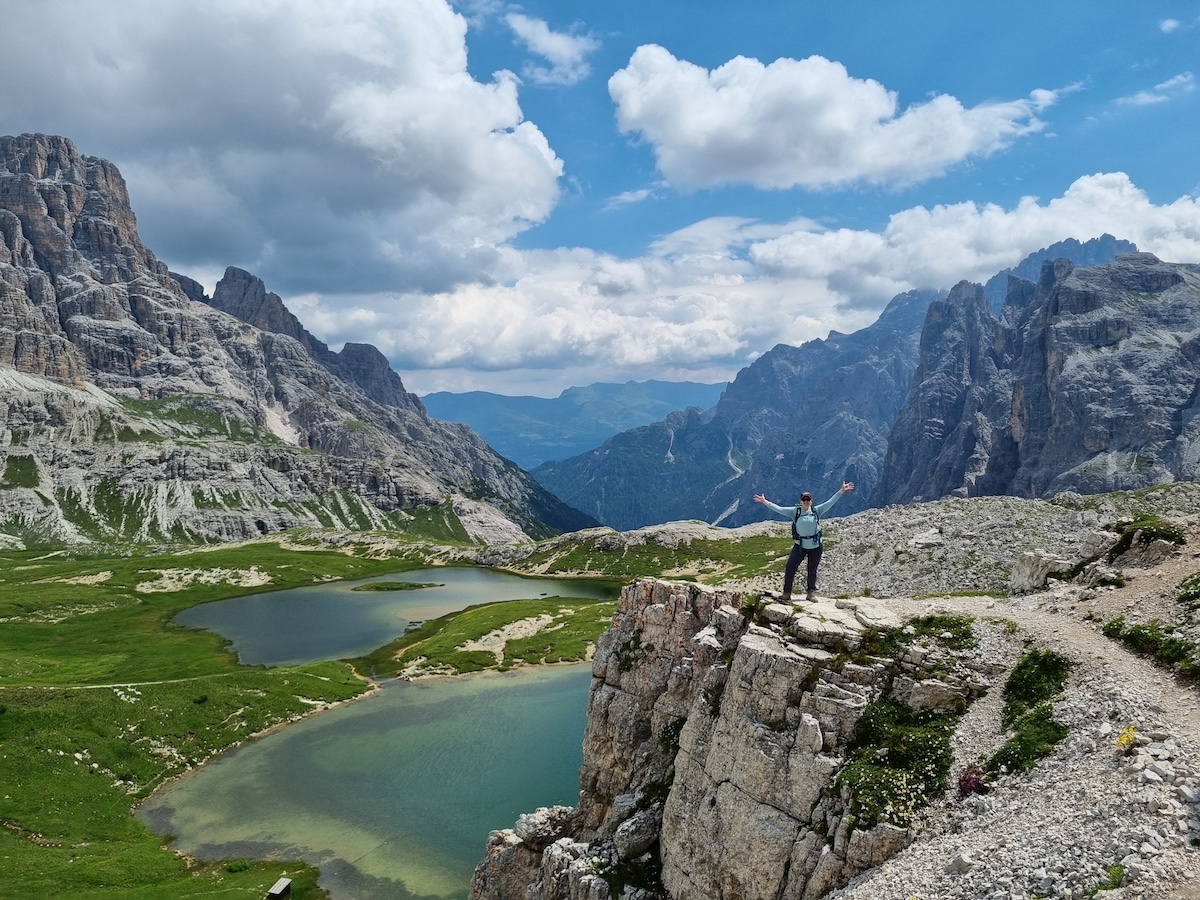 An Explorer Chick woman hiking in the Dolomites in Italy on a women's group travel tour to the Dolomites