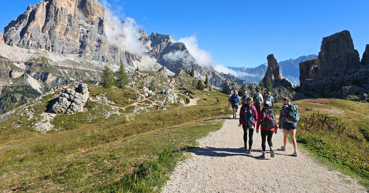 Women hiking together on an Explorer Chick small-group hiking tour in the Italian Dolomites