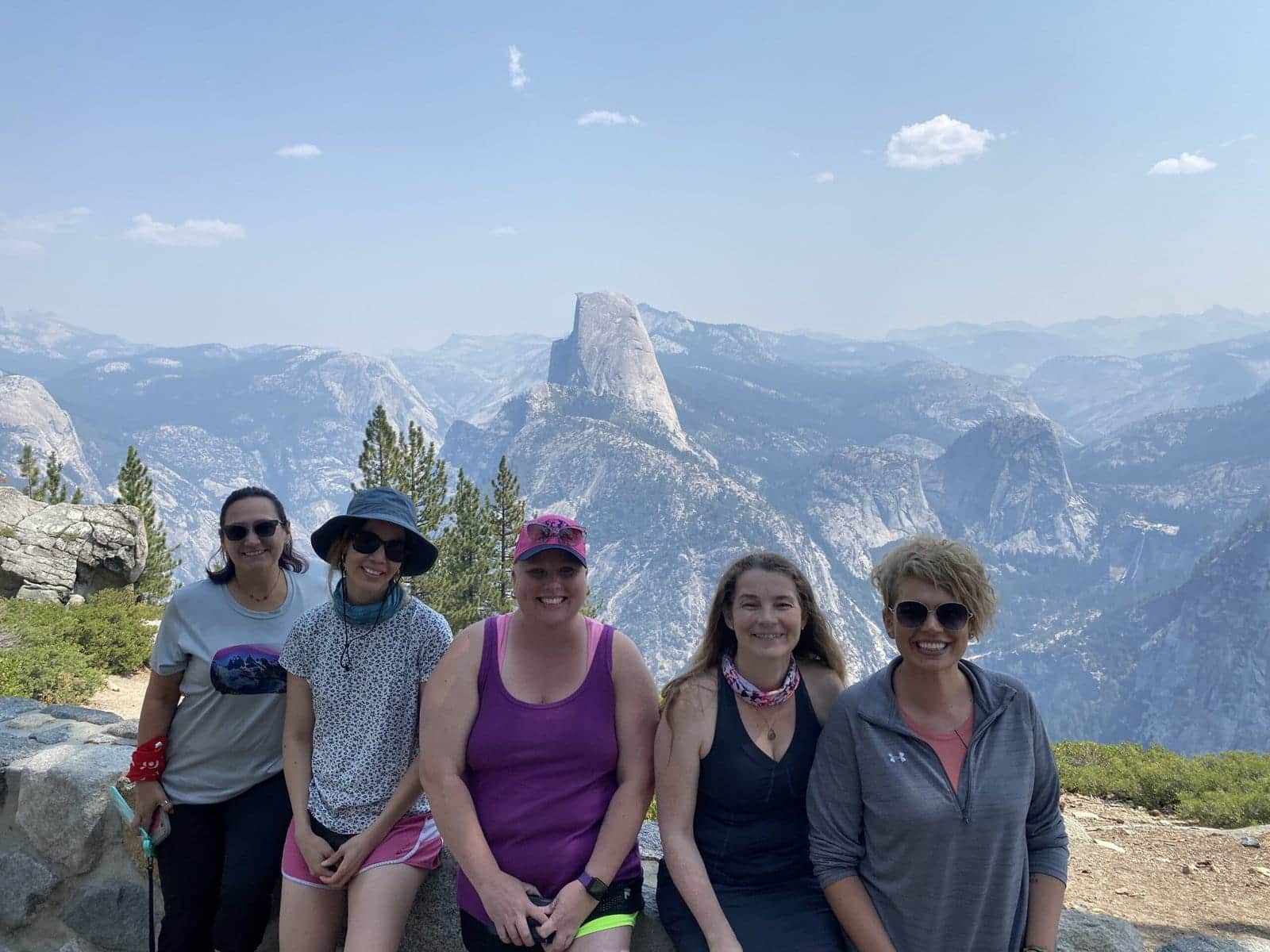 Explorer Chick women at Glacier Point in Yosemite National Park overlooking Half Dome