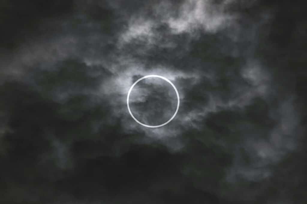 solar eclipse through clouds