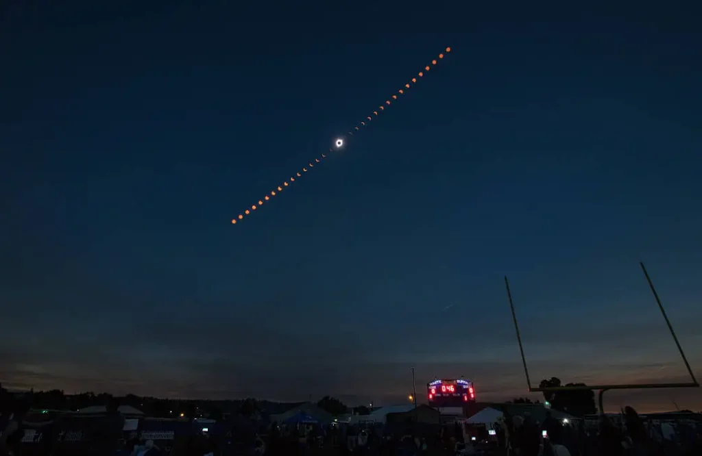 timelapse of the total solar eclipse in 2017 over a baseball field in Madras Oregon