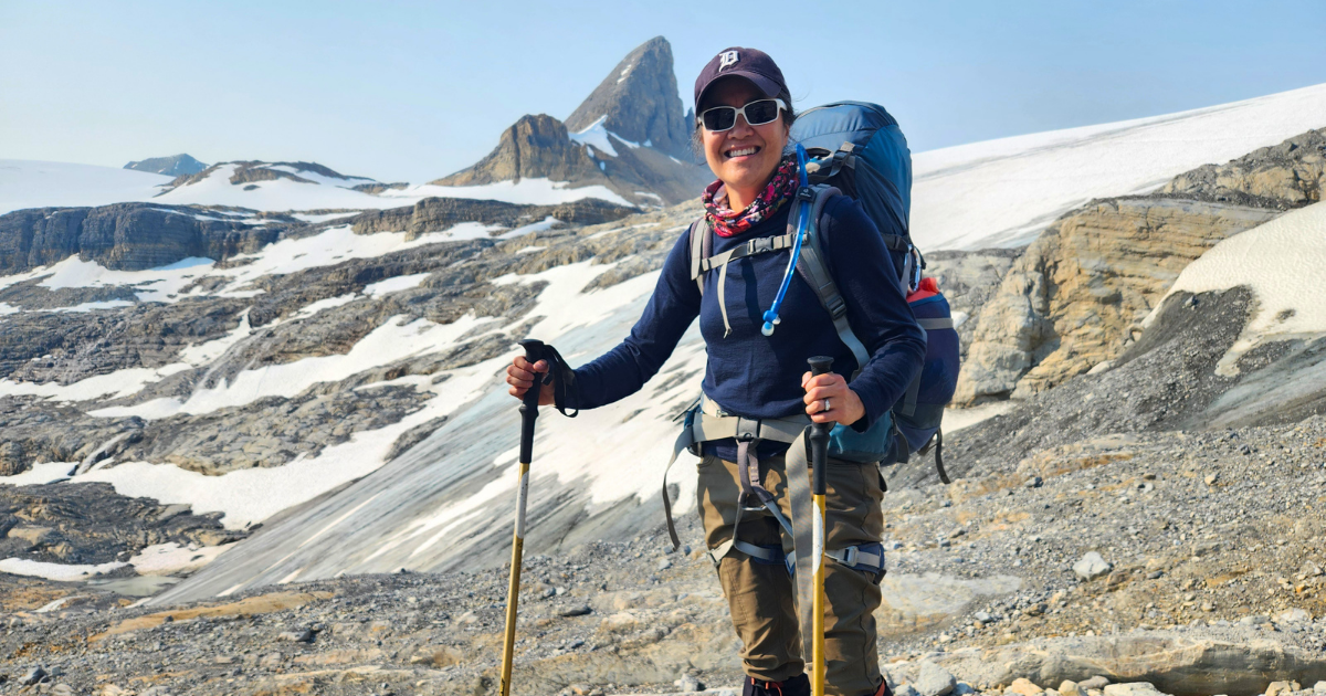 Woman trekking across Bow Glacier in Banff National Park Canadian Rockies on an Explorer Chick small-group guided women’s trekking trip