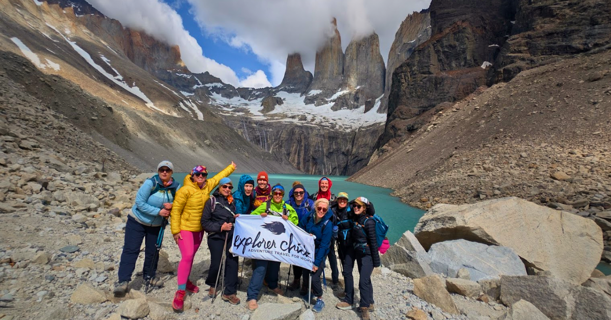 Group of women hiking to the Base Towers viewpoint in Torres del Paine Patagonia on an Explorer Chick small-group guided women’s hiking trip
